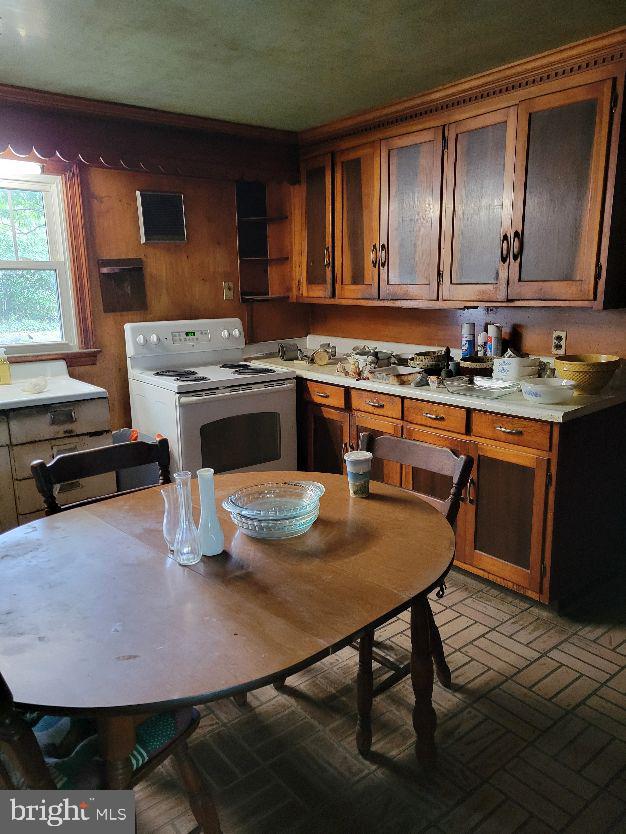 312 Front Street Dover, DE 19901 - Photo 9 of 15 a kitchen with a table chairs stove and cabinets