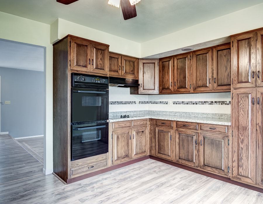 11808 Wheeler Road Durand, IL 61024 - Photo 11 of 25 a kitchen with stainless steel appliances granite countertop a refrigerator and a stove top oven