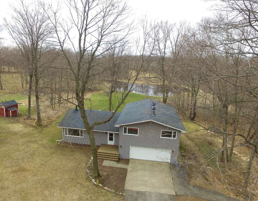11808 Wheeler Road Durand, IL 61024 - Photo 2 of 25 a house with trees in front of it