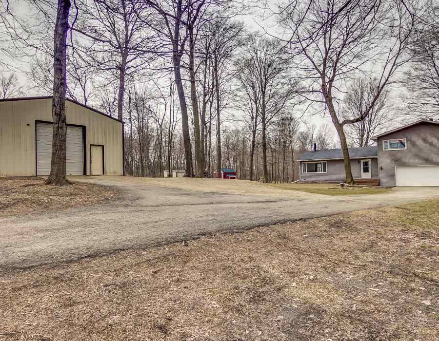11808 Wheeler Road Durand, IL 61024 - Photo 3 of 25 a front view of a house with a yard