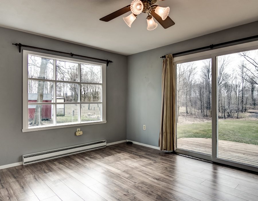 11808 Wheeler Road Durand, IL 61024 - Photo 8 of 25 a view of an empty room with wooden floor and a window