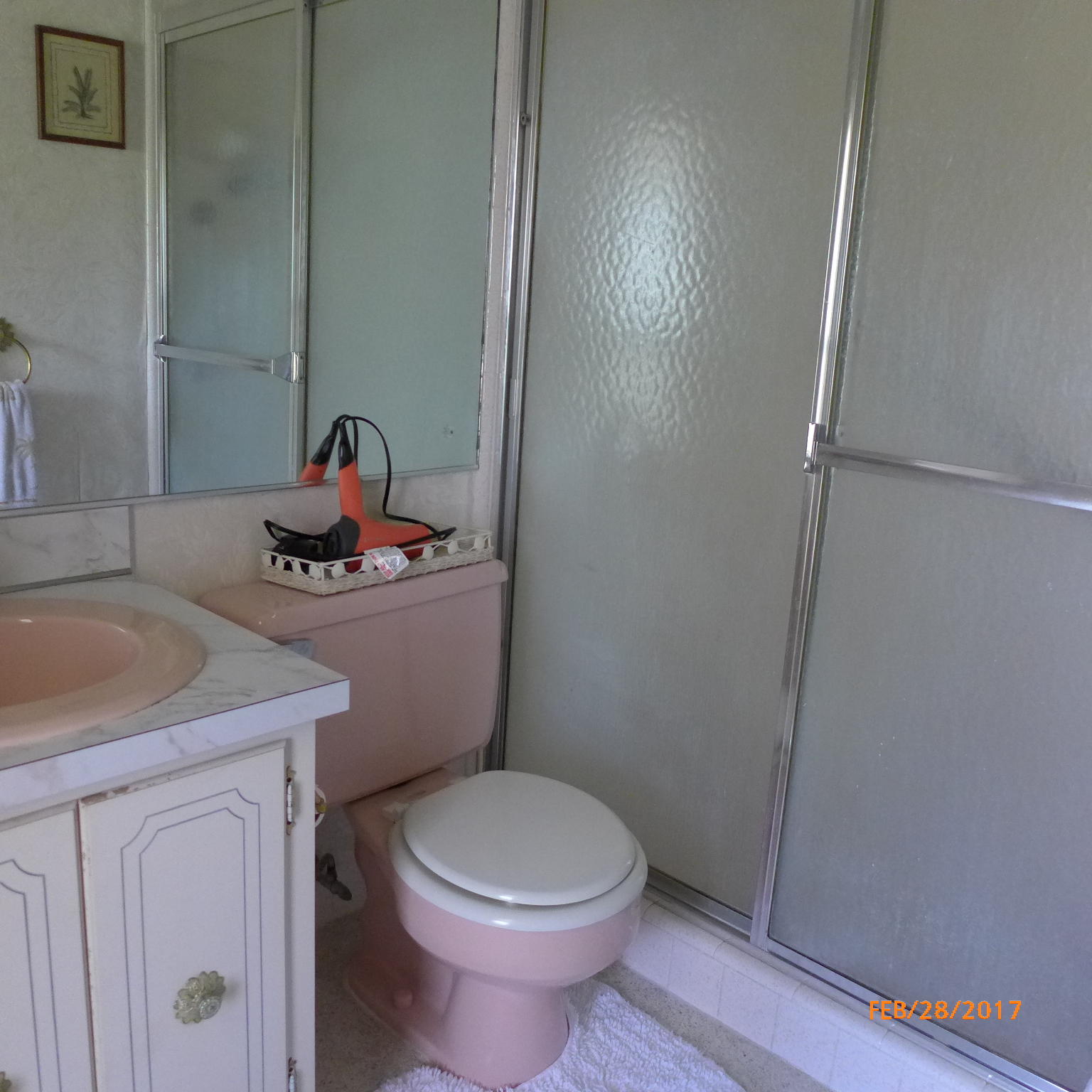 1099 Southwest 12th Avenue Boca Raton, FL 33486 - Photo 11 of 14 a bathroom with a granite countertop toilet and a sink
