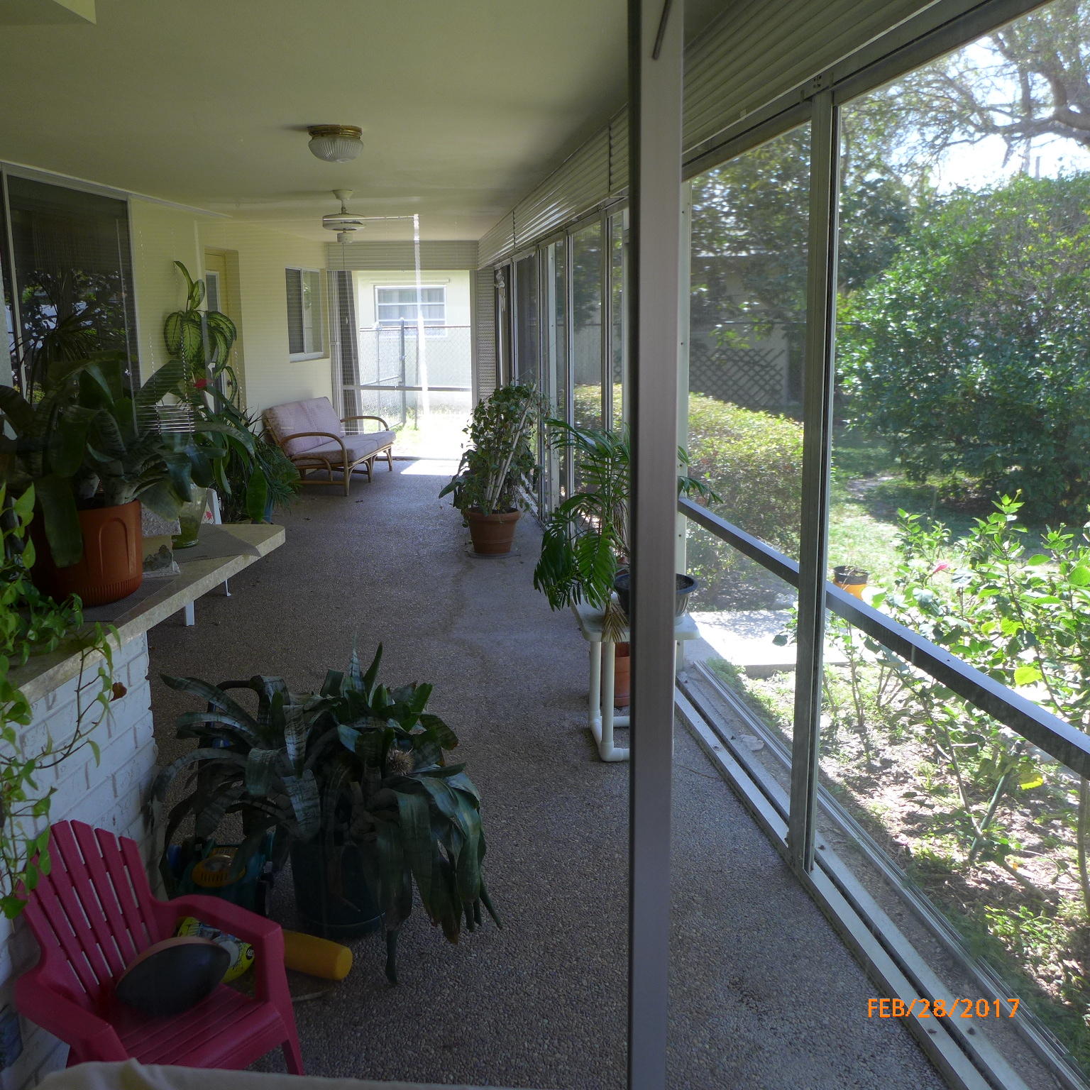 1099 Southwest 12th Avenue Boca Raton, FL 33486 - Photo 12 of 14 a living room filled with furniture and a potted plant