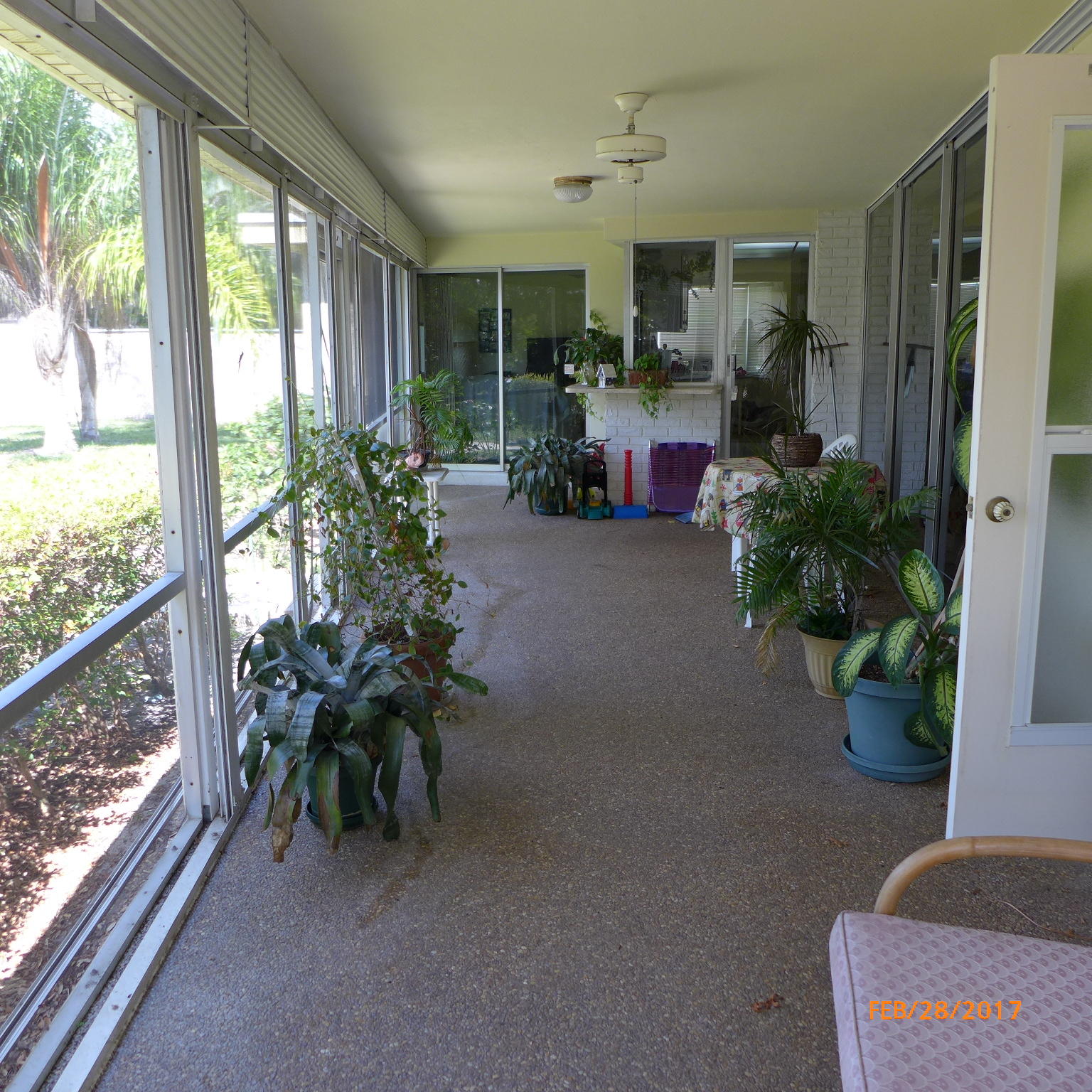 1099 Southwest 12th Avenue Boca Raton, FL 33486 - Photo 3 of 14 a living room filled with furniture and a potted plant