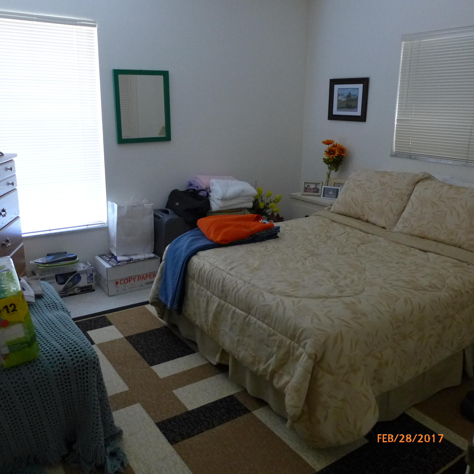 1099 Southwest 12th Avenue Boca Raton, FL 33486 - Photo 9 of 14 a bedroom with a bed and wooden floor