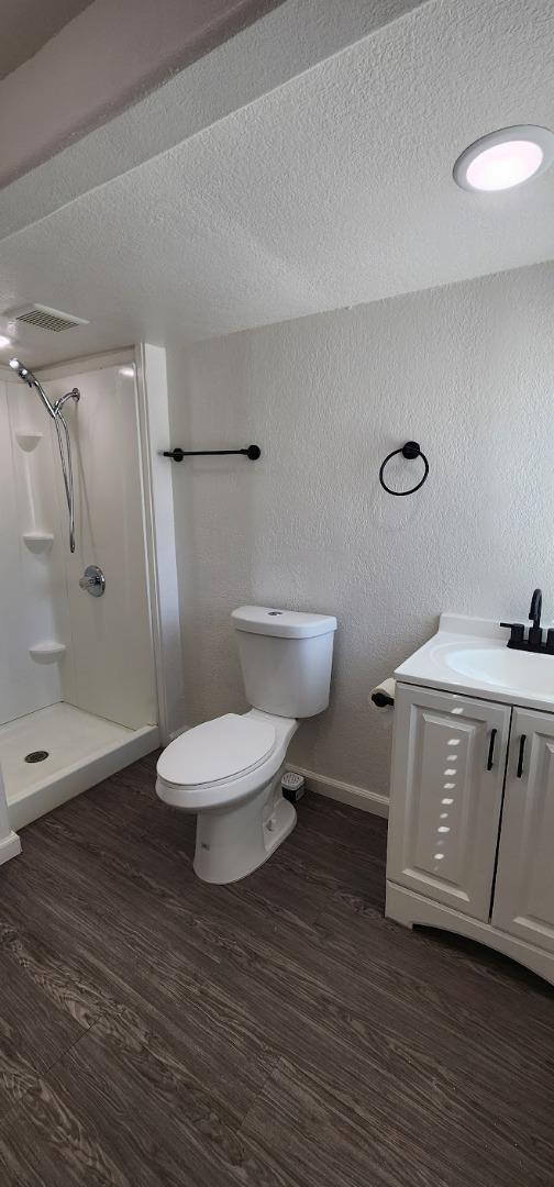 3499 East Bayshore Road, Unit 86 Redwood City, CA 94063 - Photo 16 of 21 a bathroom with a toilet a sink and shower