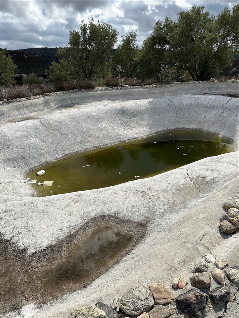 34930 East Benton Road Hemet, CA 92544 - Photo 49 of 54 a view of swimming pool with a yard and large trees