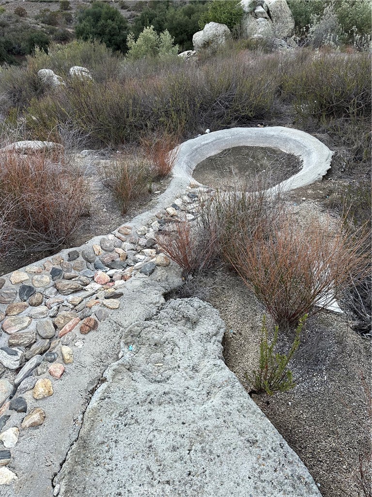 34930 East Benton Road Hemet, CA 92544 - Photo 51 of 54 a view of a water fountain in a backyard