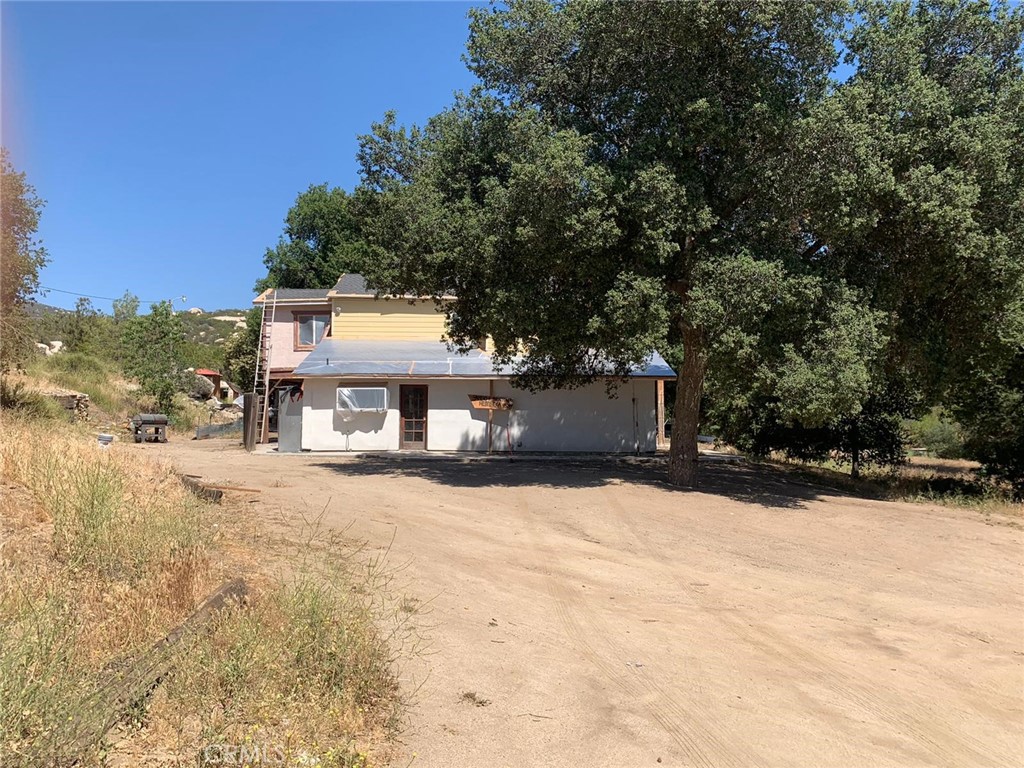 34930 East Benton Road Hemet, CA 92544 - Photo 6 of 54 a front view of a house with a yard covered in snow