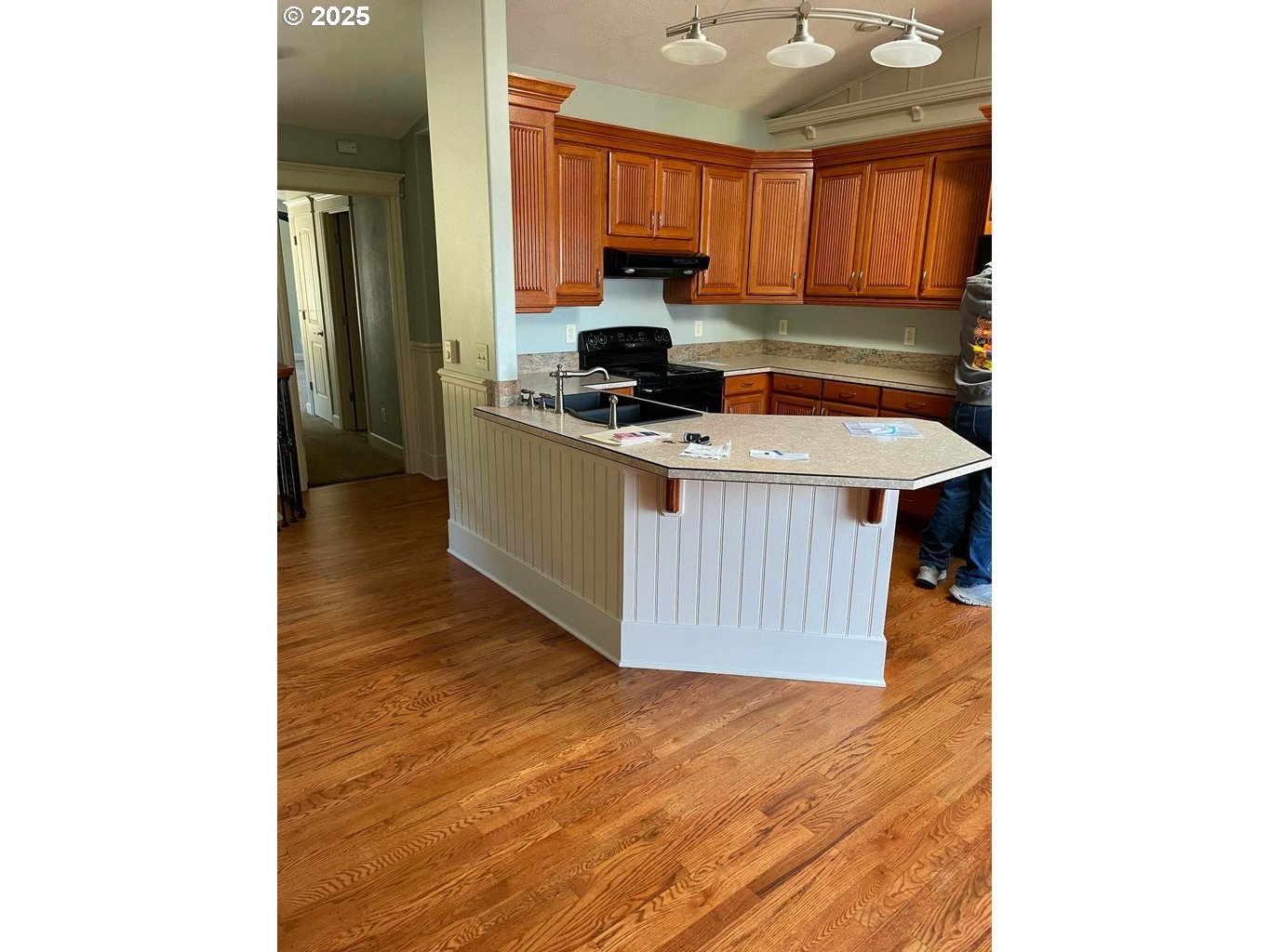 409 Evergreen Avenue Garibaldi, OR 97118 - Photo 15 of 48 a kitchen with a sink and a refrigerator