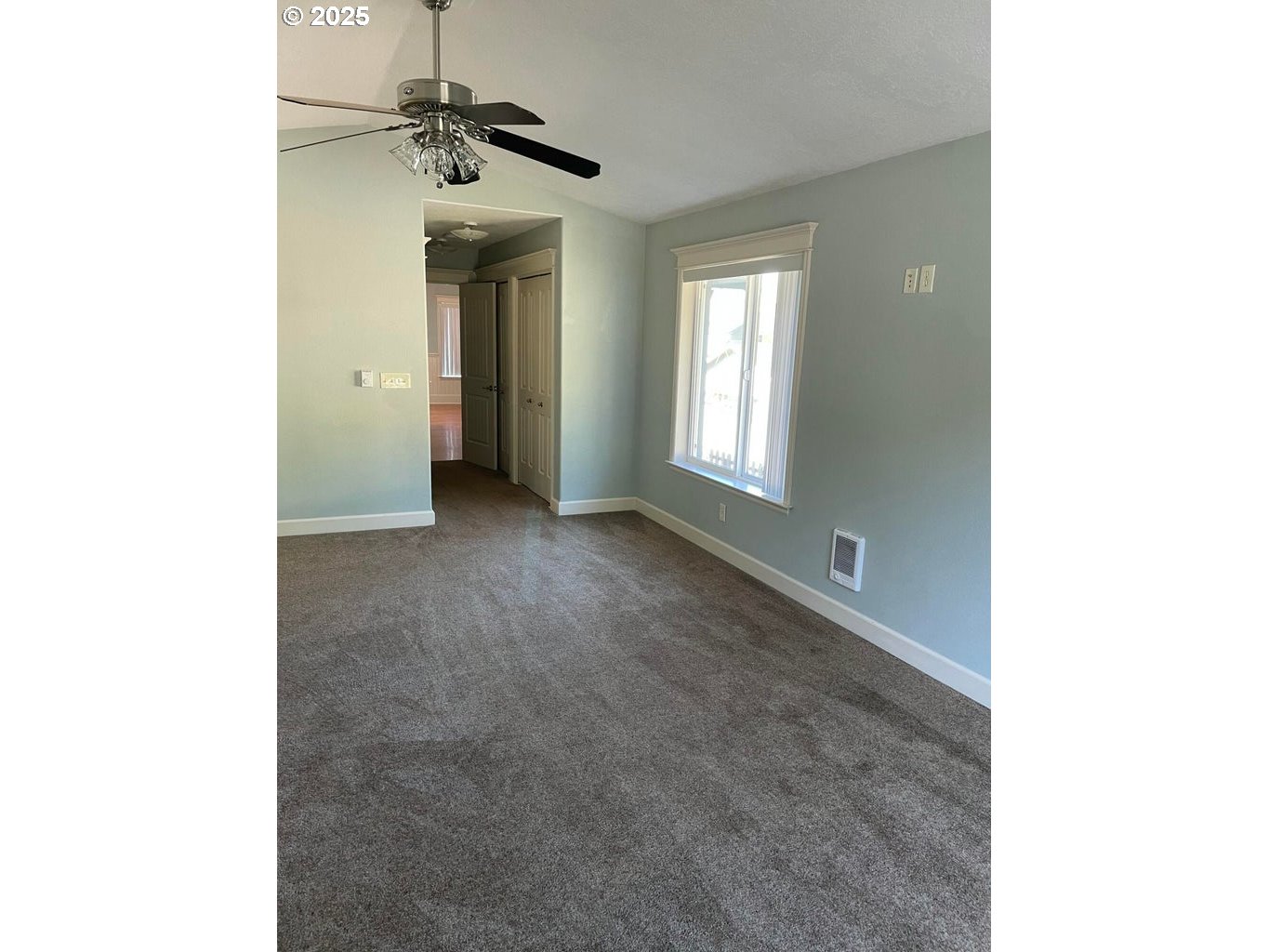 409 Evergreen Avenue Garibaldi, OR 97118 - Photo 23 of 48 a view of a room with a ceiling fan and window