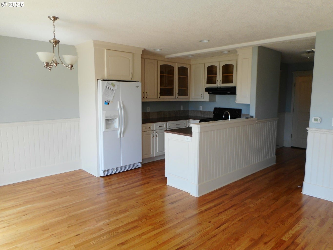 409 Evergreen Avenue Garibaldi, OR 97118 - Photo 35 of 48 a view of a kitchen with wooden floor and electronic appliances