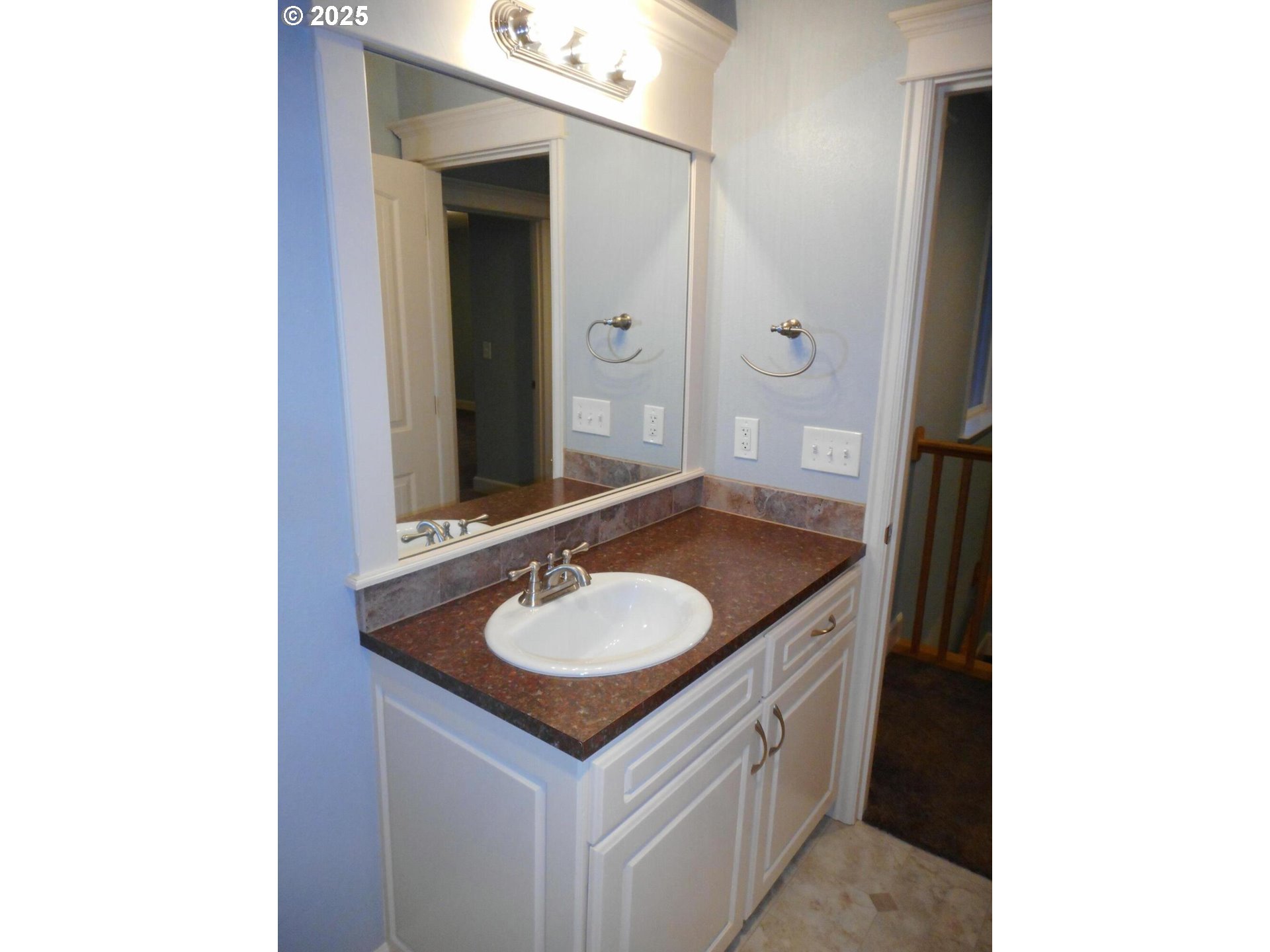409 Evergreen Avenue Garibaldi, OR 97118 - Photo 40 of 48 a bathroom with a granite countertop sink and a mirror