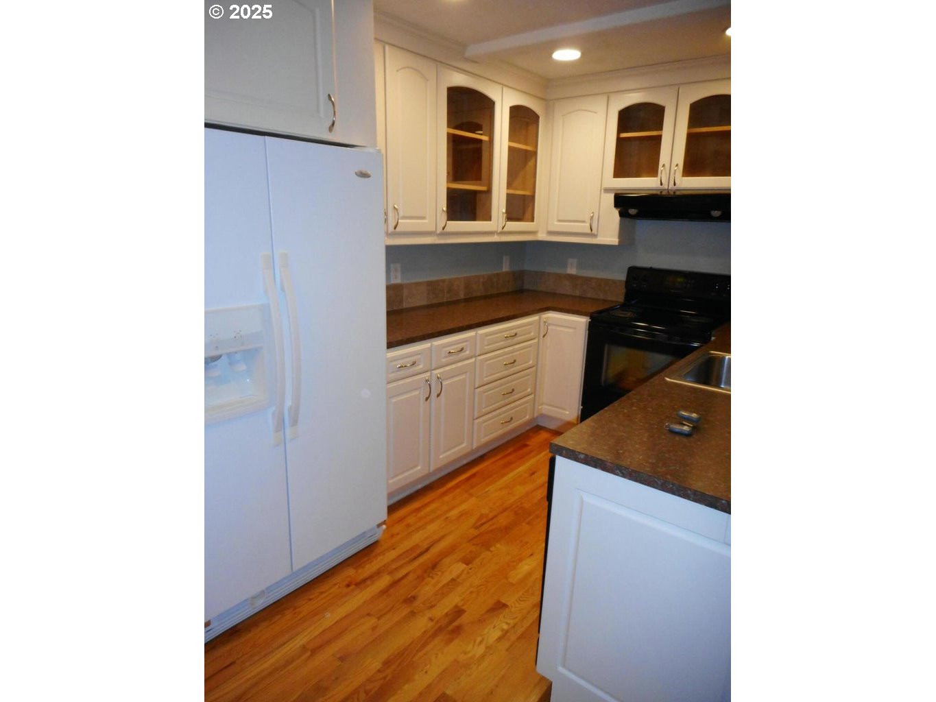 409 Evergreen Avenue Garibaldi, OR 97118 - Photo 45 of 48 a kitchen with stainless steel appliances granite countertop a refrigerator and a sink
