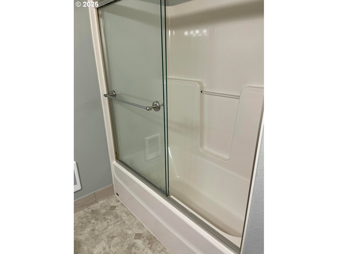 409 Evergreen Avenue Garibaldi, OR 97118 - Photo 9 of 48 a bathroom with a glass shower door