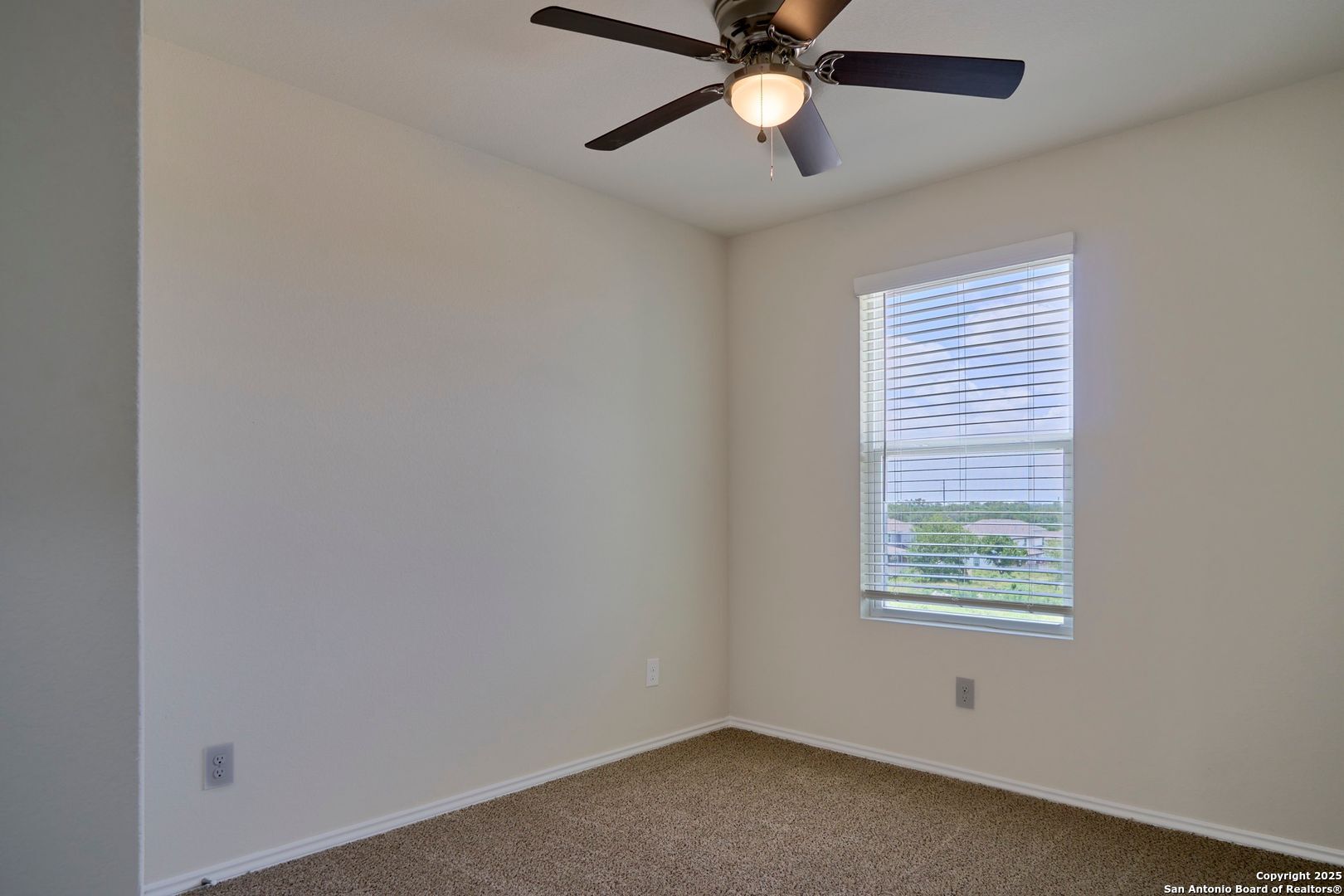 482 Abigail Alley San Antonio, TX 78253 - Photo 11 of 27 an empty room with a window and a fan
