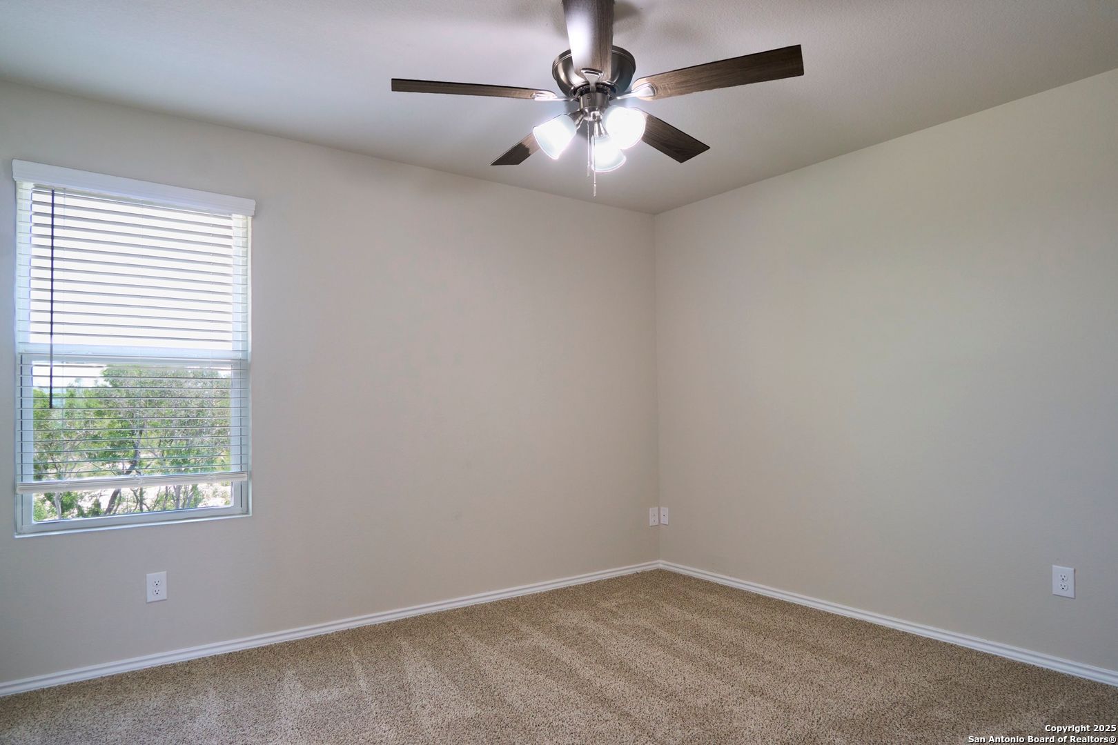 482 Abigail Alley San Antonio, TX 78253 - Photo 17 of 27 an empty room with a window and a fan