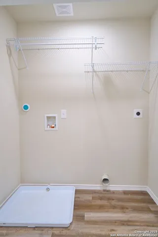 a backyard of a house with a garden and barbeque