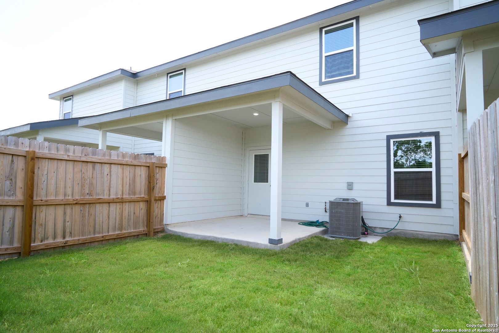 482 Abigail Alley San Antonio, TX 78253 - Photo 23 of 27 a backyard of a house with a garden and barbeque