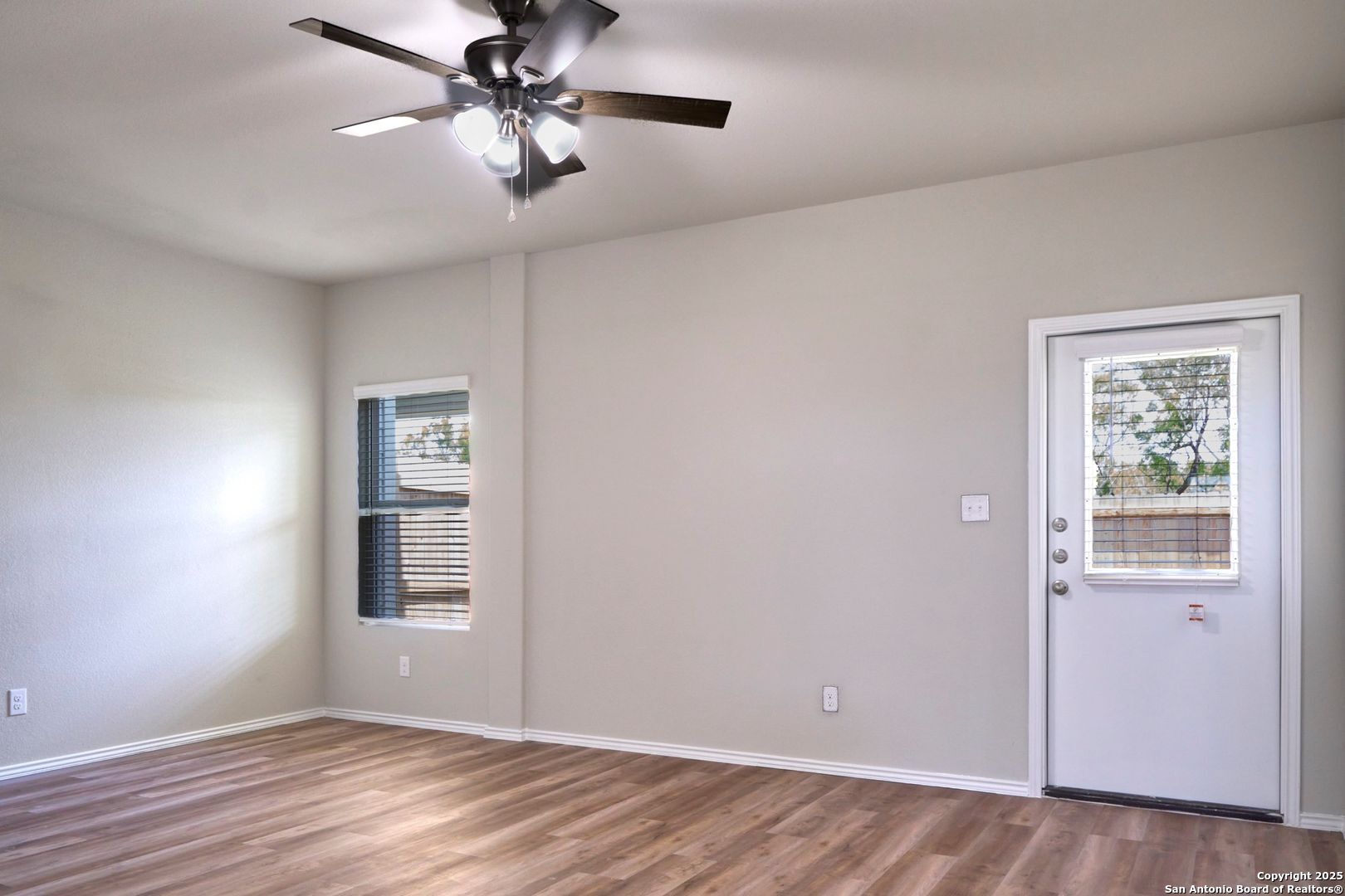 482 Abigail Alley San Antonio, TX 78253 - Photo 5 of 27 an empty room with windows and fan