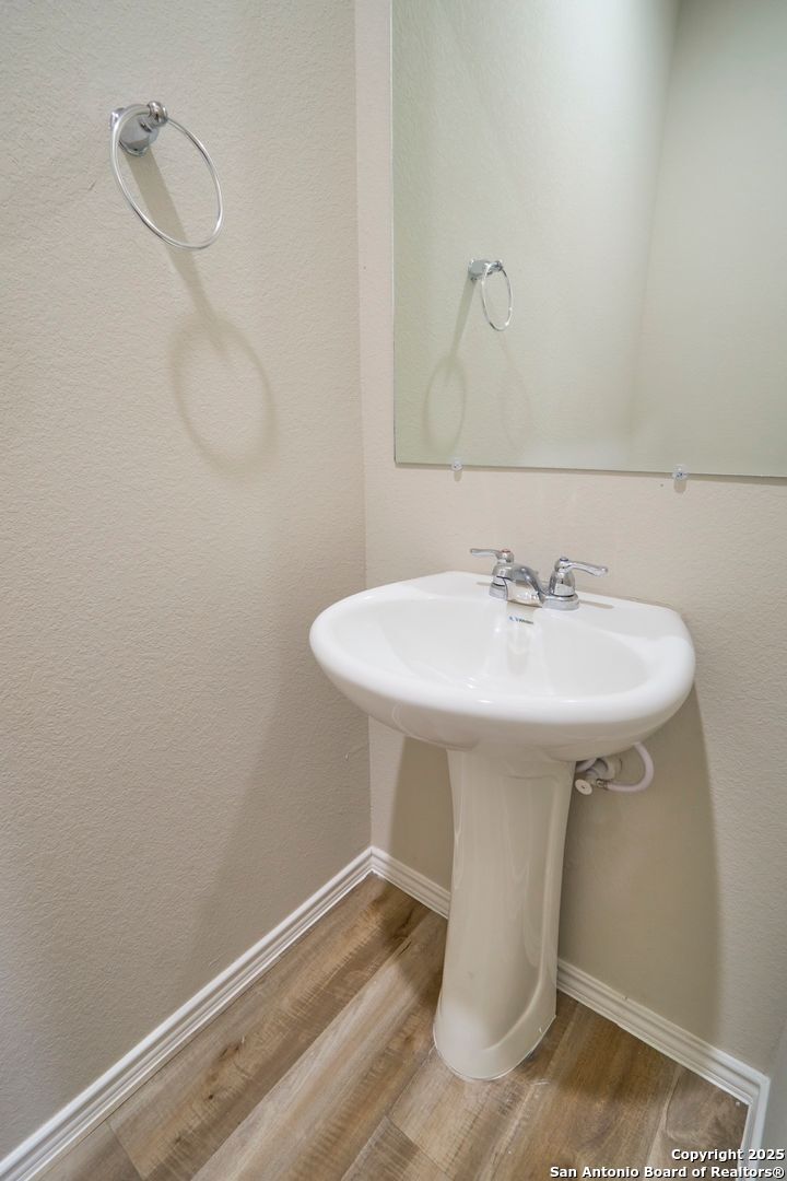 482 Abigail Alley San Antonio, TX 78253 - Photo 9 of 27 a bathroom with a sink and a mirror