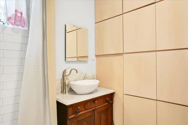 a bathroom with a sink and a mirror