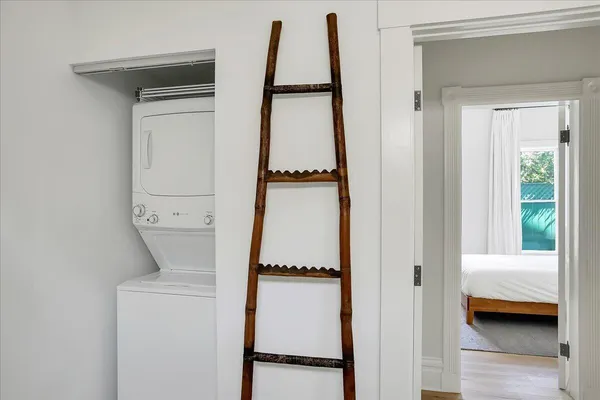 a bedroom with a bed and a flat tv screen in it