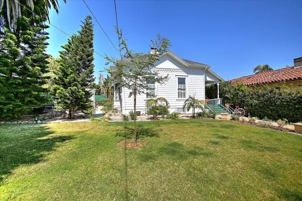 a view of a backyard of the house