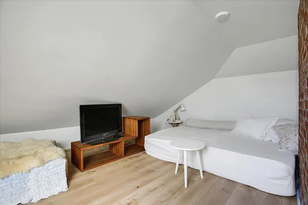 a room with a bench and cabinets