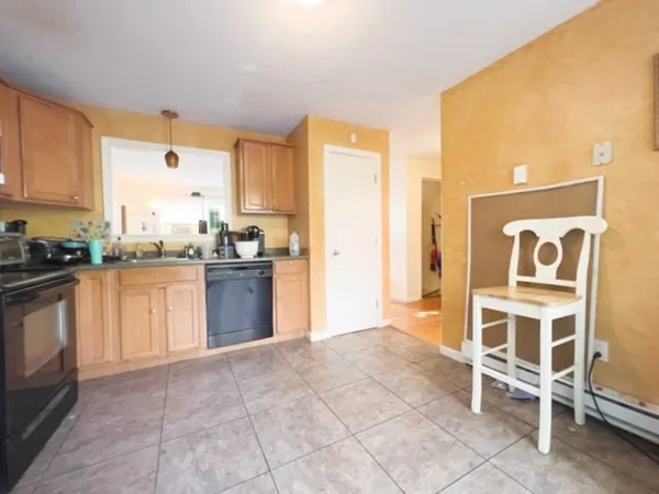 a kitchen with a stove a sink and a refrigerator