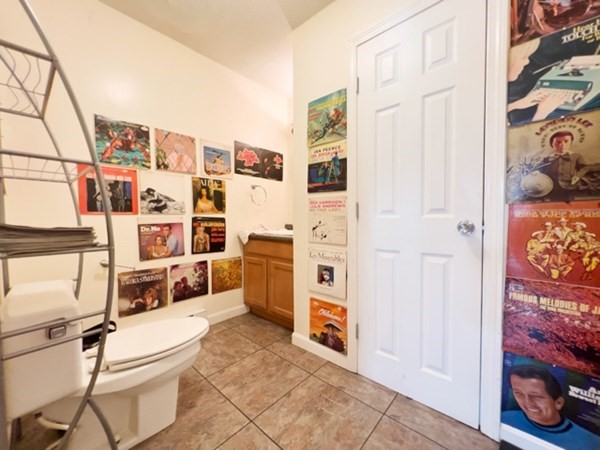 45 Lawn Street, Unit PE Boston, MA 02120 - Photo 22 of 26 a white house with stainless steel appliances kitchen island granite countertop a refrigerator and a stove