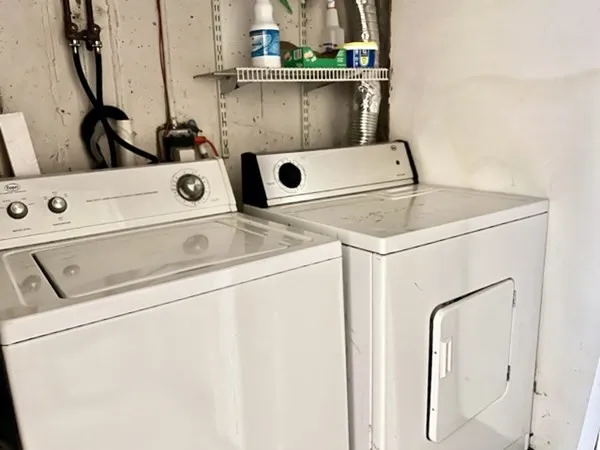 a bedroom with a bed and a desk