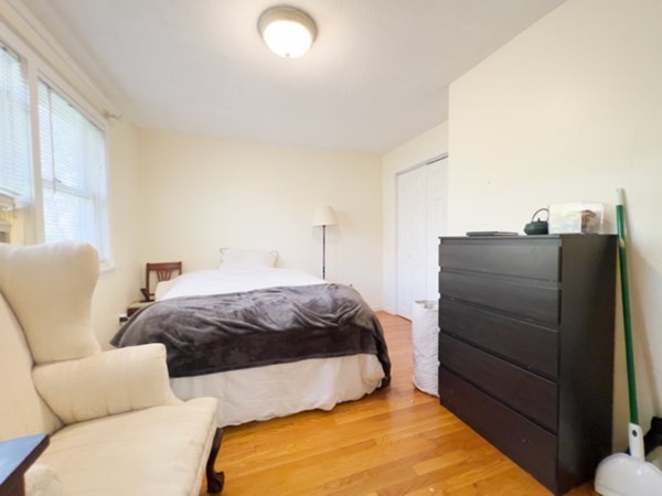 45 Lawn Street, Unit PE Boston, MA 02120 - Photo 8 of 26 a bedroom with a bed and dresser