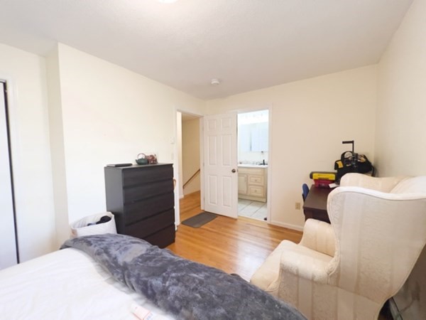 45 Lawn Street, Unit PE Boston, MA 02120 - Photo 10 of 26 a bedroom with a bed and furniture