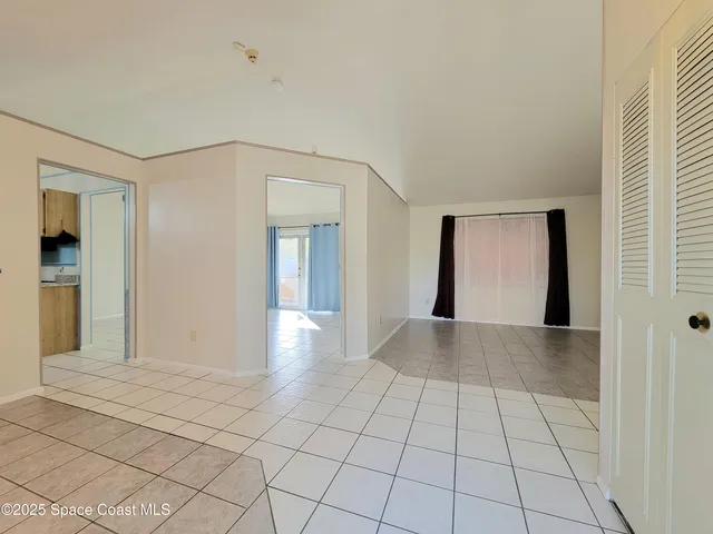 a view of an empty room and window