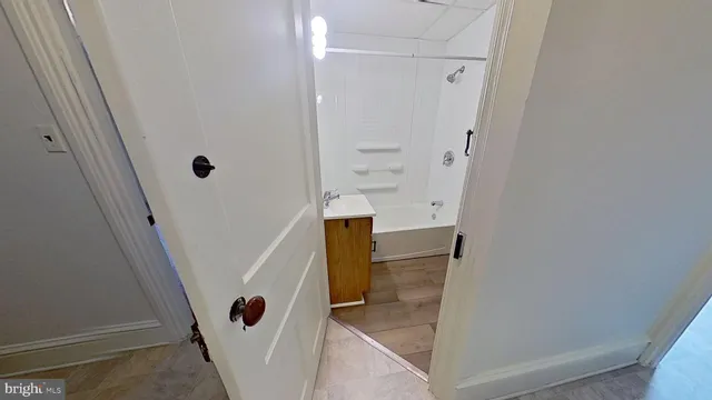 a view of an empty room and a window