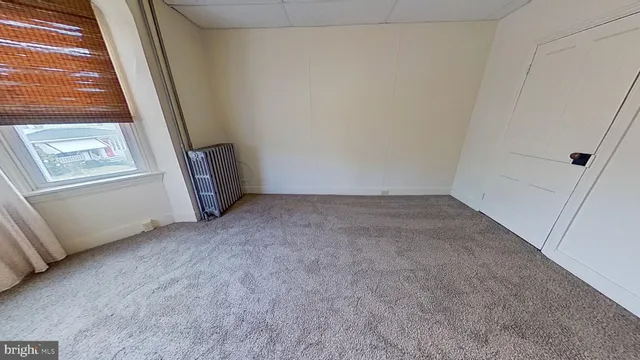 an empty room with wooden floor