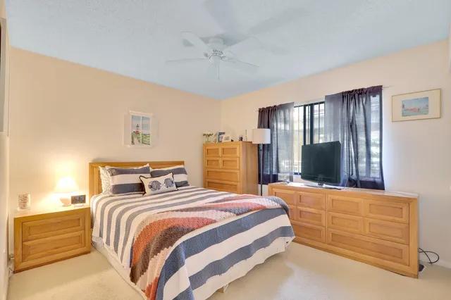 a bedroom with bed and window