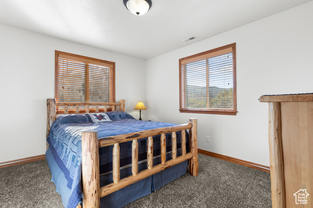 1340 Trapper Loop Garden City, UT 84028 - Photo 22 of 35 Carpeted bedroom with baseboards