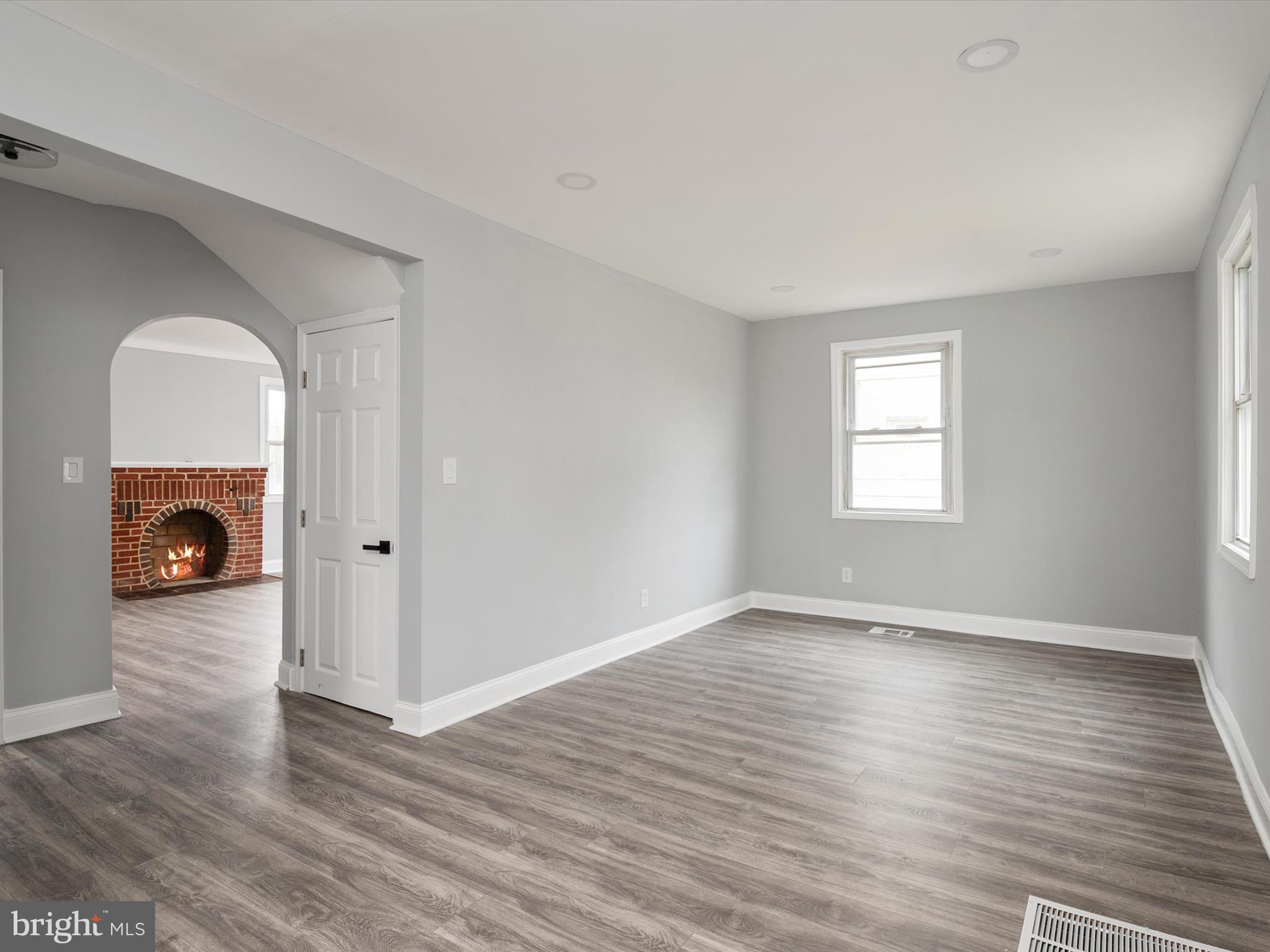 5002 Silver Hill Road Suitland, MD 20746 - Photo 12 of 39 an empty room with wooden floor and a window