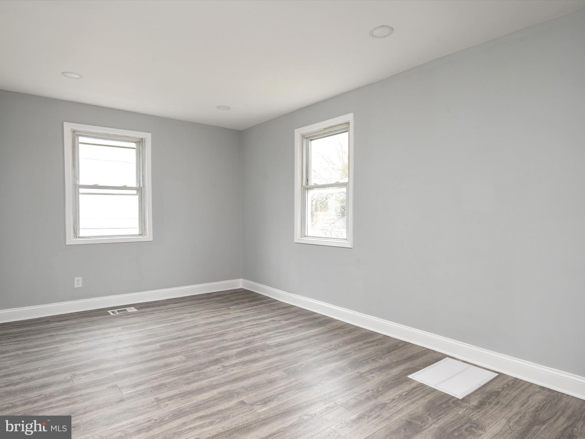 5002 Silver Hill Road Suitland, MD 20746 - Photo 13 of 39 a view of a room with wooden floor and windows in it
