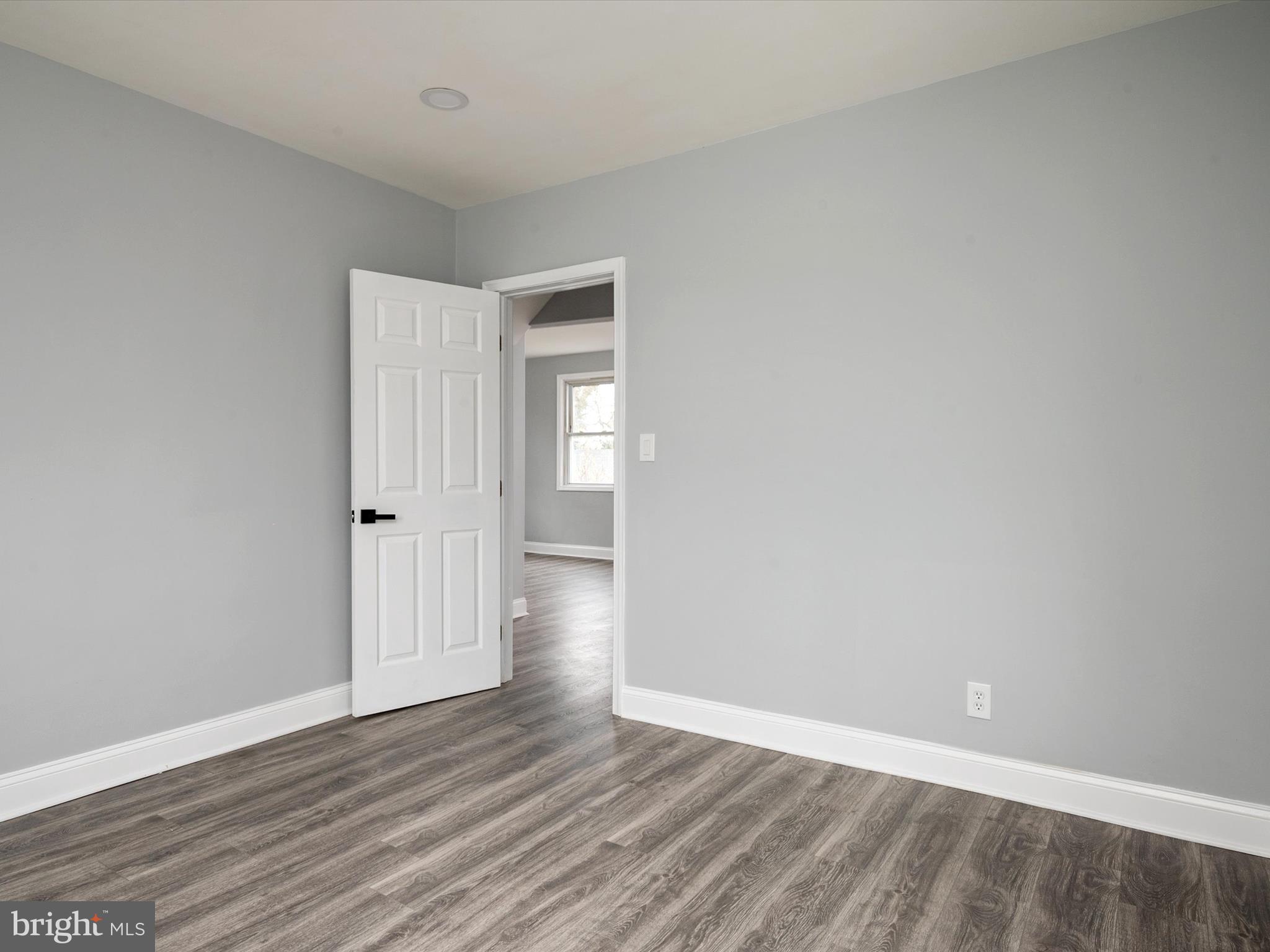5002 Silver Hill Road Suitland, MD 20746 - Photo 15 of 39 a view of an empty room and wooden floor