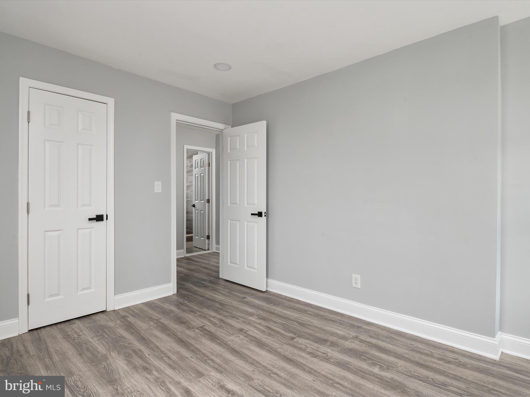 5002 Silver Hill Road Suitland, MD 20746 - Photo 18 of 39 a view of an empty room and wooden floor