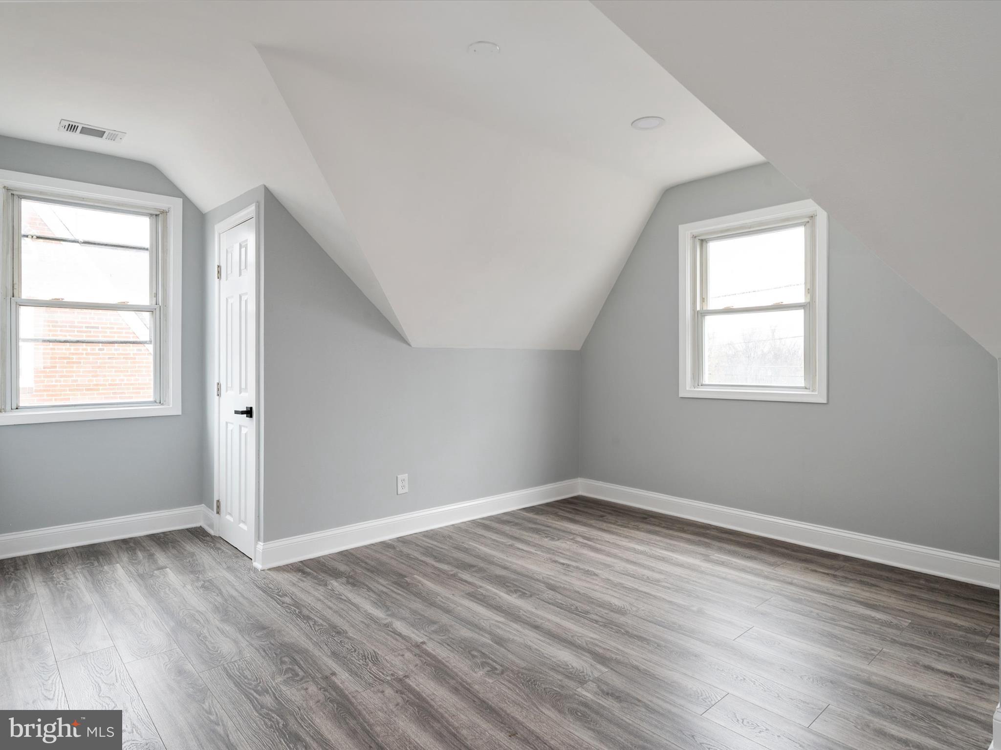 5002 Silver Hill Road Suitland, MD 20746 - Photo 20 of 39 an empty room with wooden floor and windows