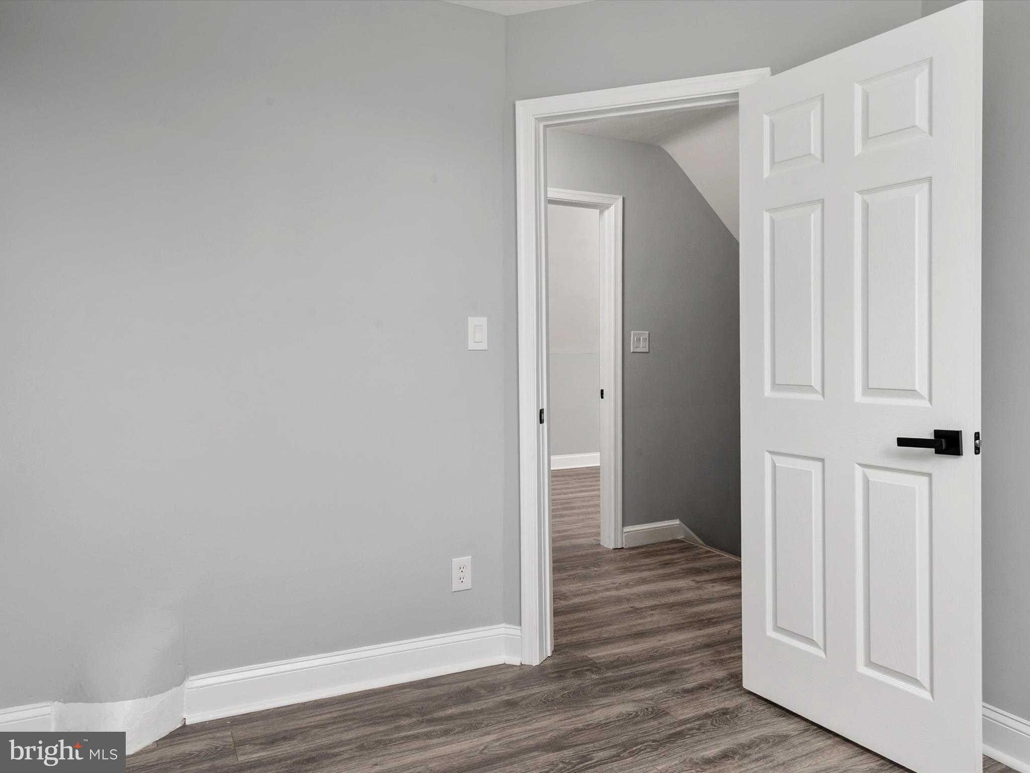 5002 Silver Hill Road Suitland, MD 20746 - Photo 23 of 39 a view of a hallway with wooden floor