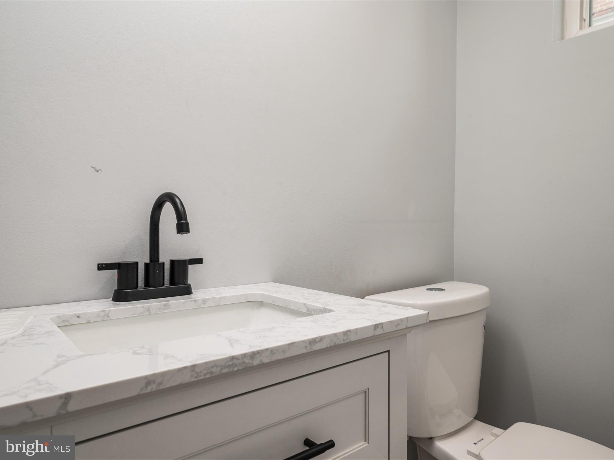 5002 Silver Hill Road Suitland, MD 20746 - Photo 30 of 39 a close view of a sink and a toilet