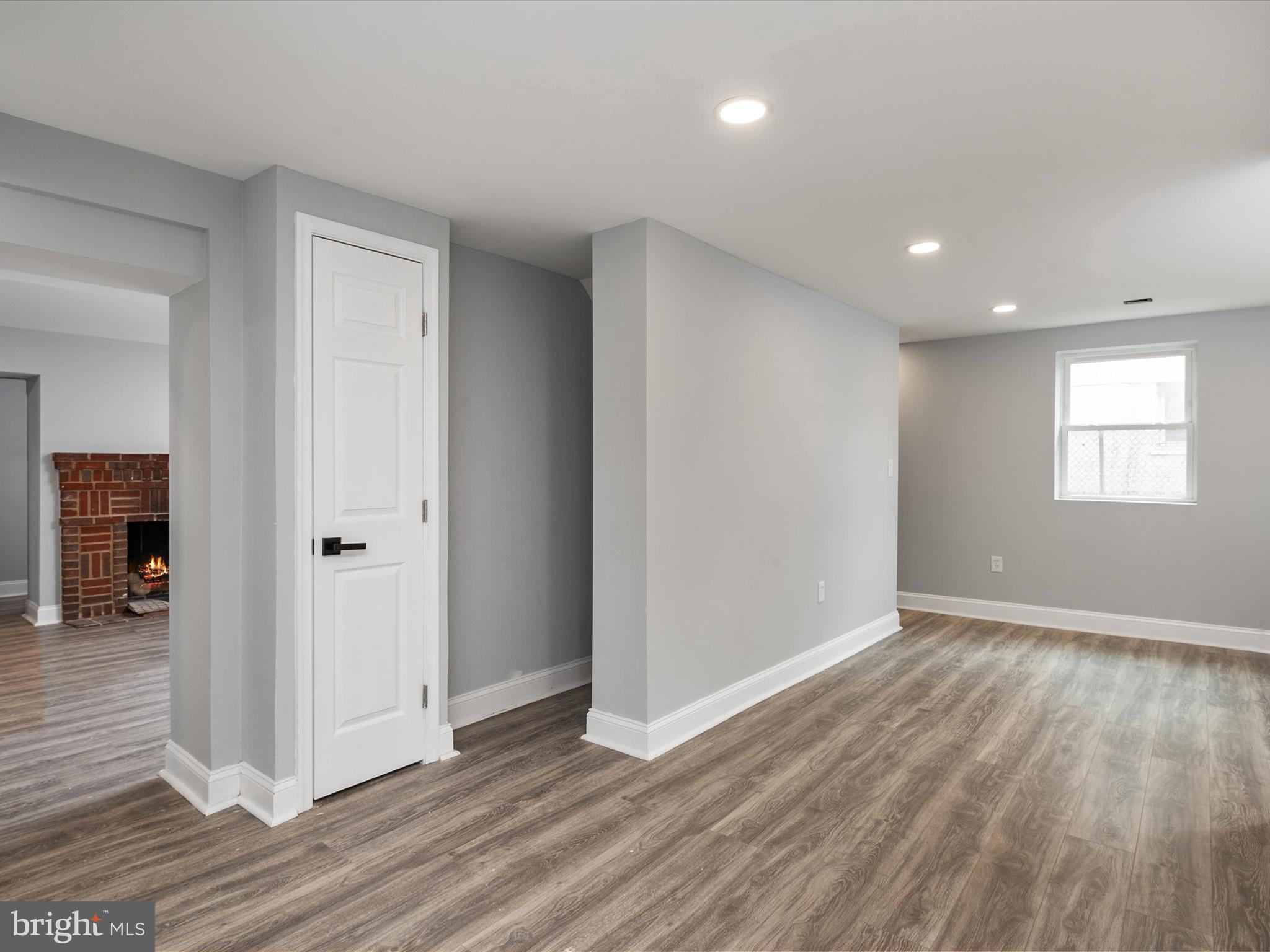 5002 Silver Hill Road Suitland, MD 20746 - Photo 32 of 39 a view of an empty room with wooden floor and a window
