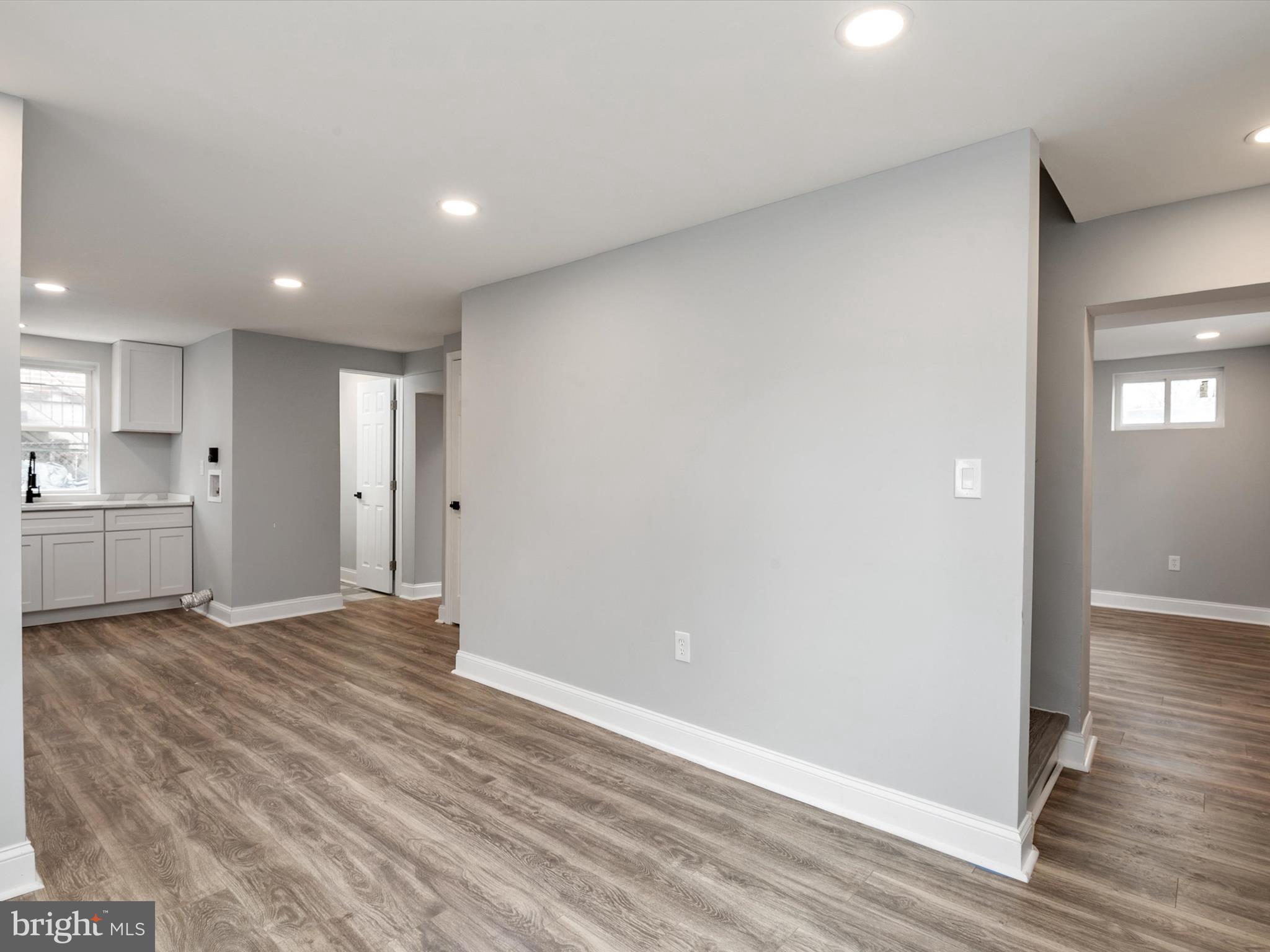 5002 Silver Hill Road Suitland, MD 20746 - Photo 33 of 39 a view of an empty room with wooden floor and a window