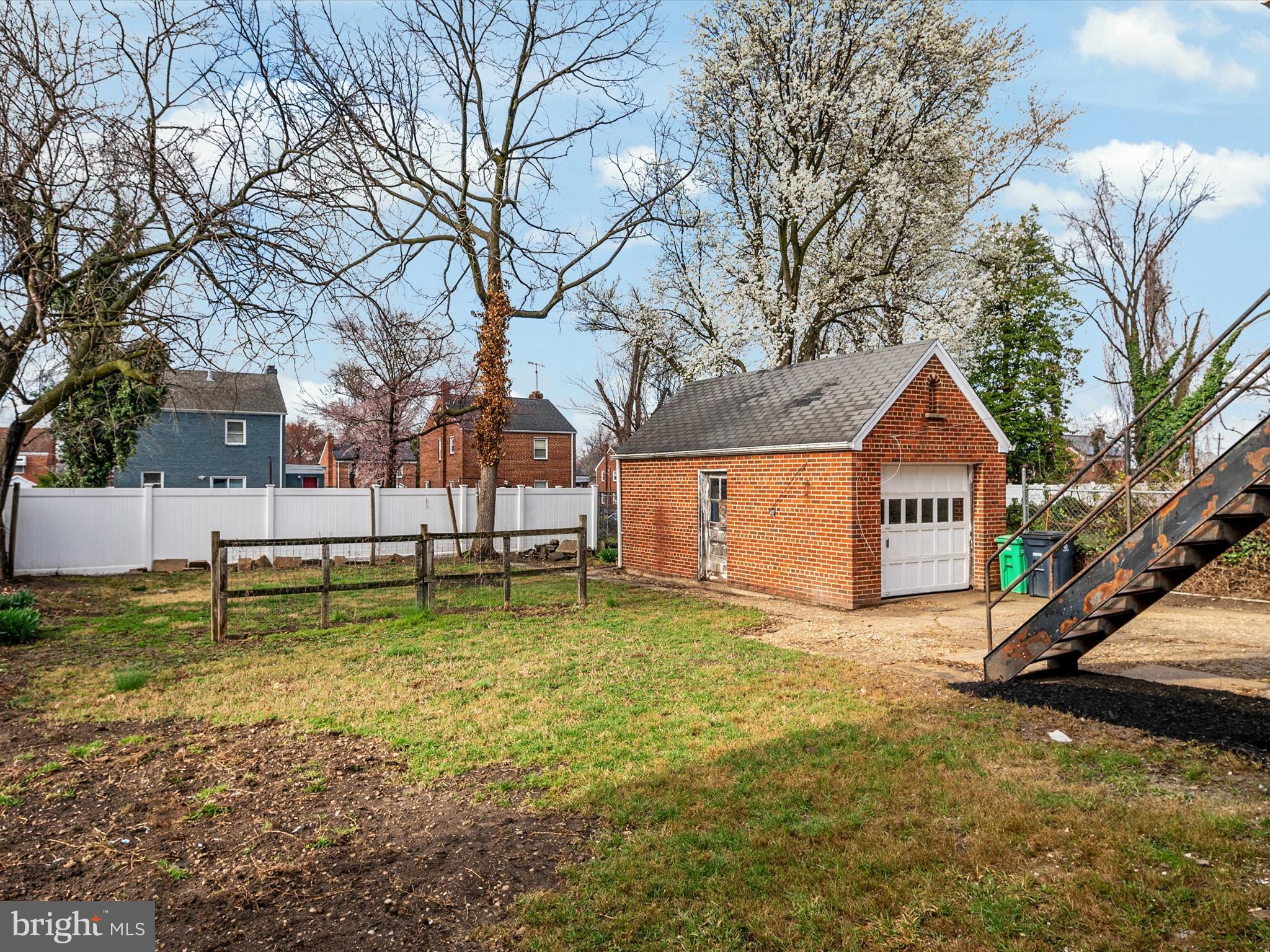 5002 Silver Hill Road Suitland, MD 20746 - Photo 38 of 39 a swimming pool with wooden fence and trees