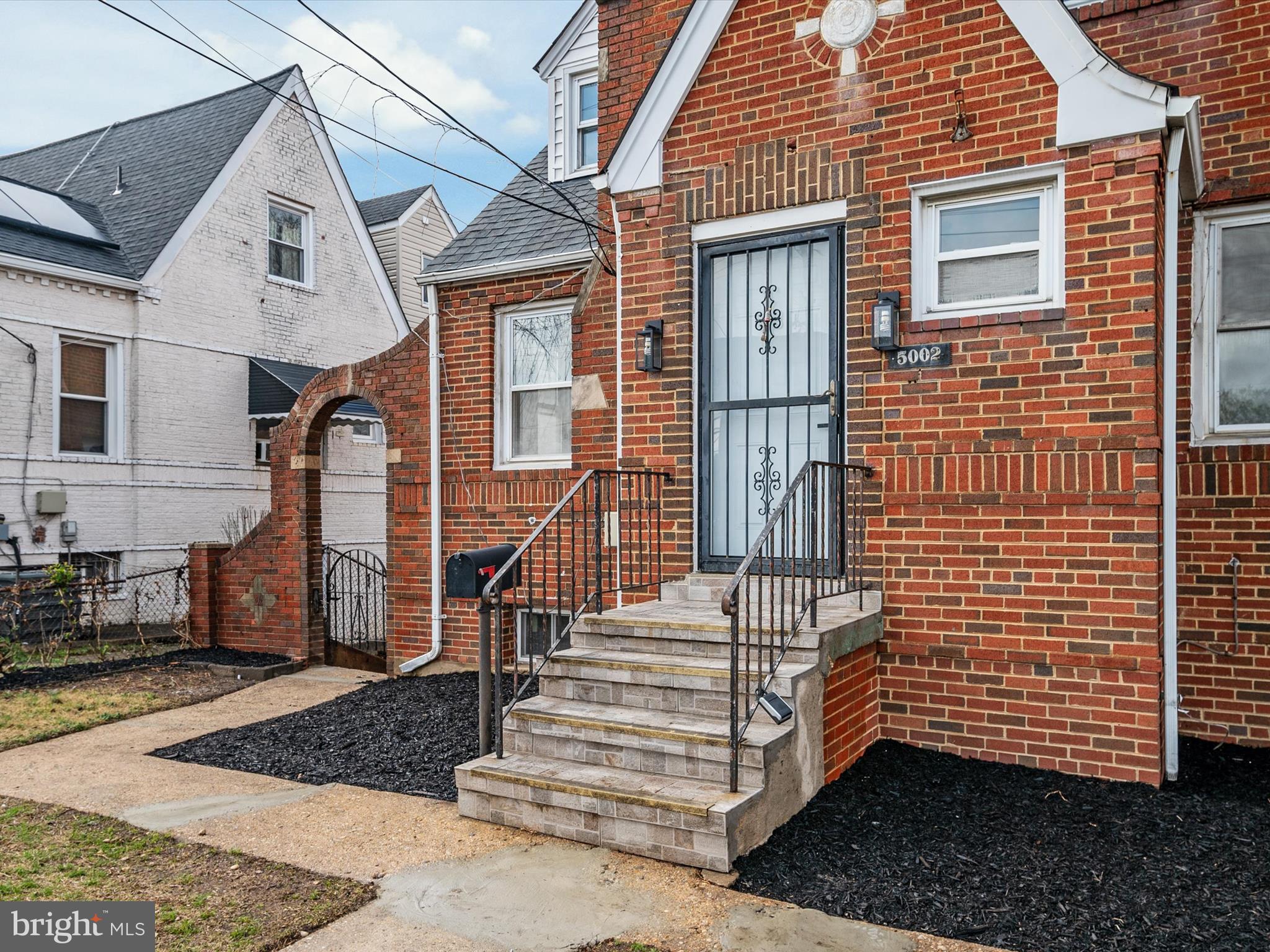 5002 Silver Hill Road Suitland, MD 20746 - Photo 4 of 39 a front view of a house with stairs